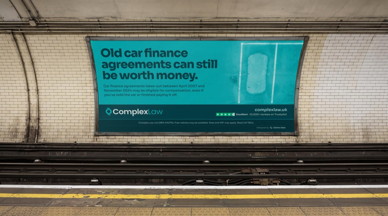 Cross-track poster on a Tube platform: “Old car finance agreements can still be worth money.”