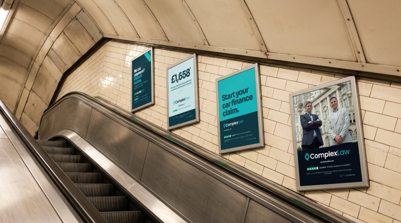 Four escalator panels: “No car anymore? Doesn’t matter.”, “£1,658”, “Start your car finance claim.” and a team photo