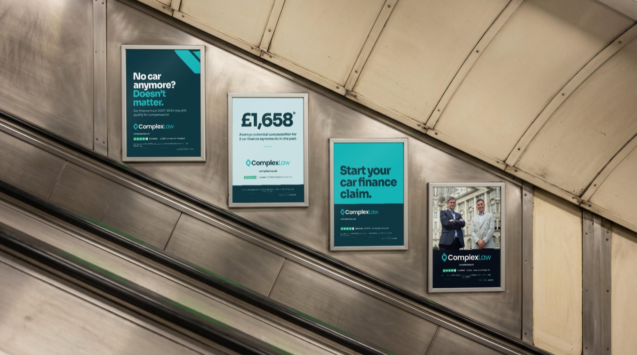 Escalator panels beside the escalator, the same four adverts